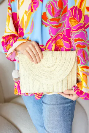 Raffia Flap Closure Clutch Bag with Wrist Strap and Pom Pom