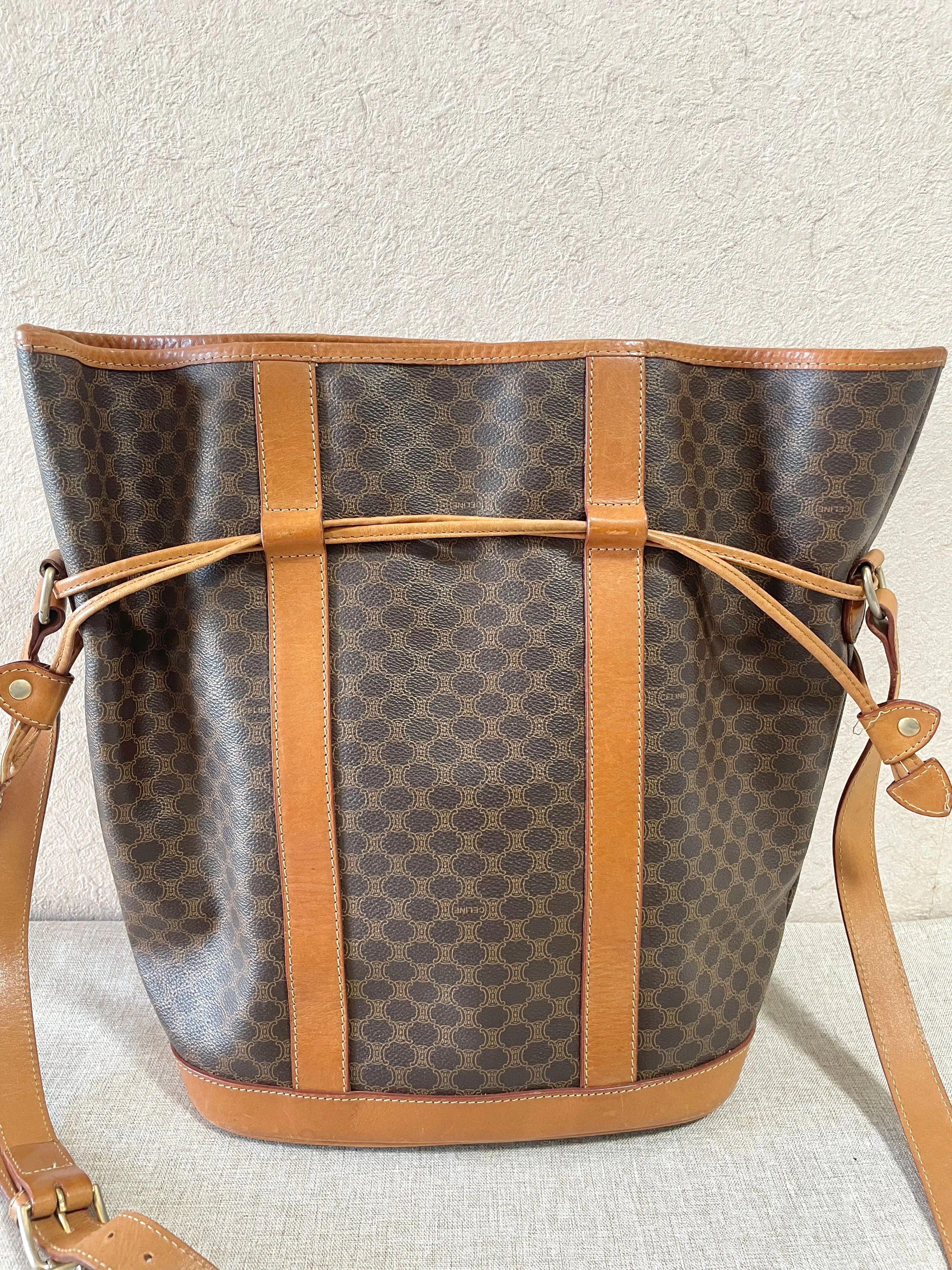 Vintage Celine hobo bucket shoulder bag in classic brown triomphe pattern with leather straps. 070218ys8