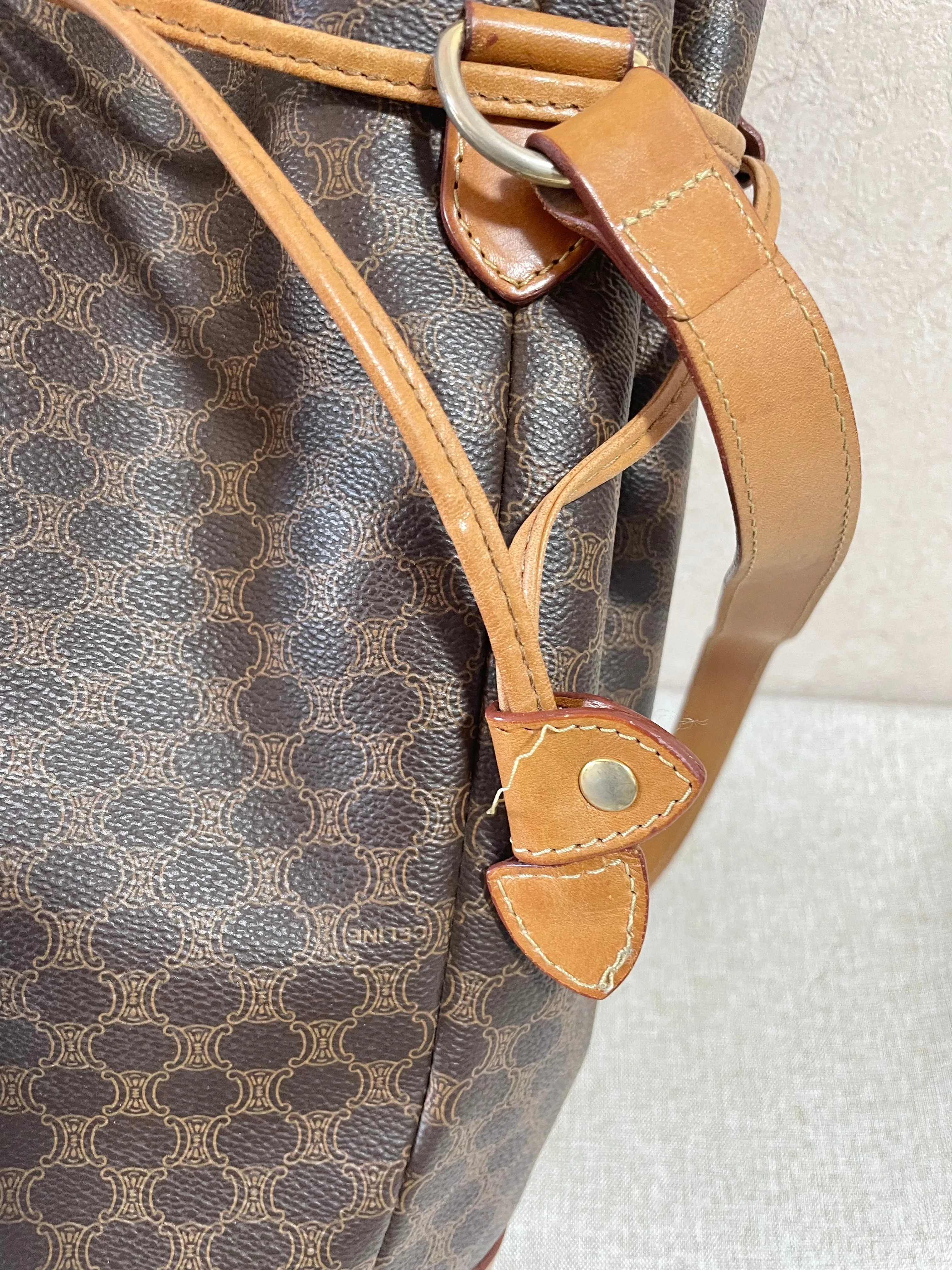 Vintage Celine hobo bucket shoulder bag in classic brown triomphe pattern with leather straps. 070218ys8