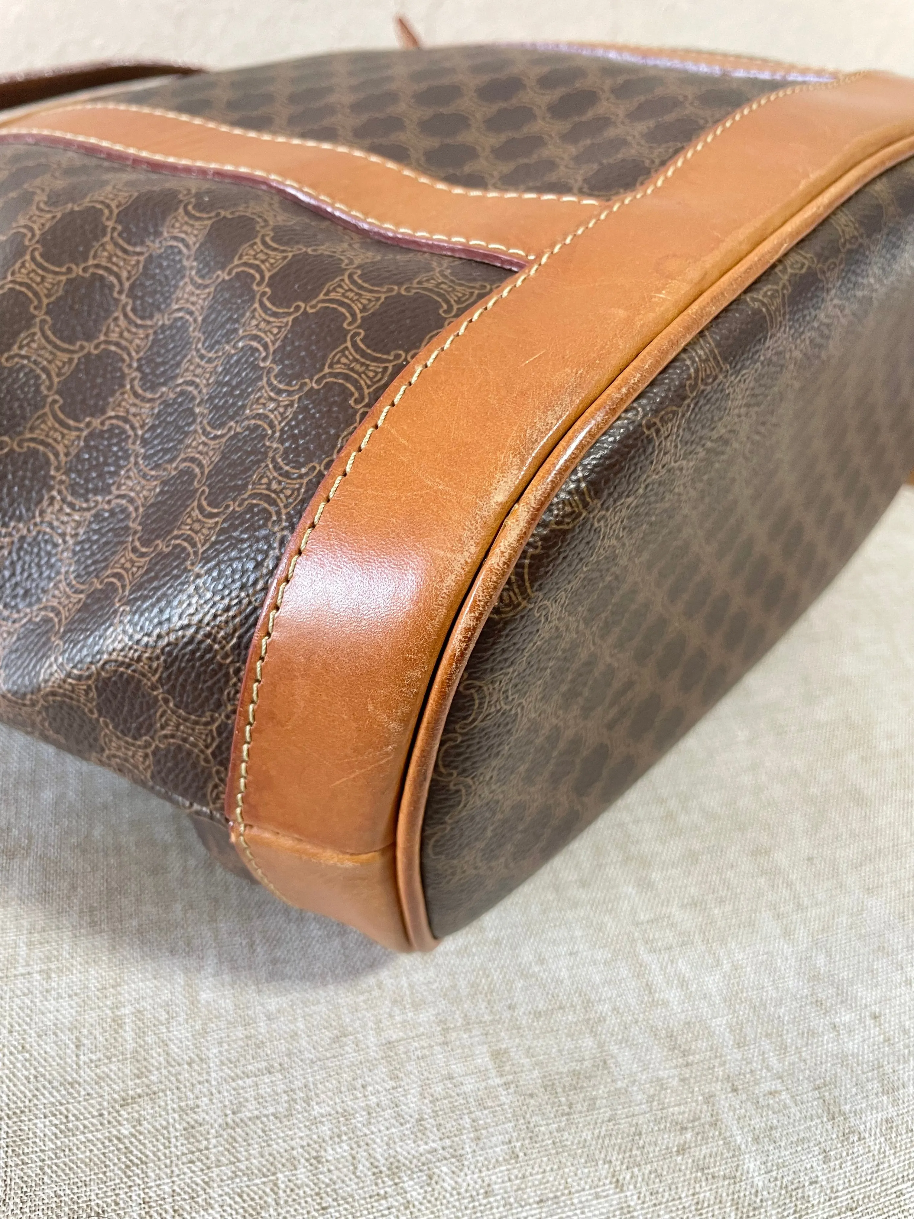 Vintage Celine hobo bucket shoulder bag in classic brown triomphe pattern with leather straps. 070218ys8
