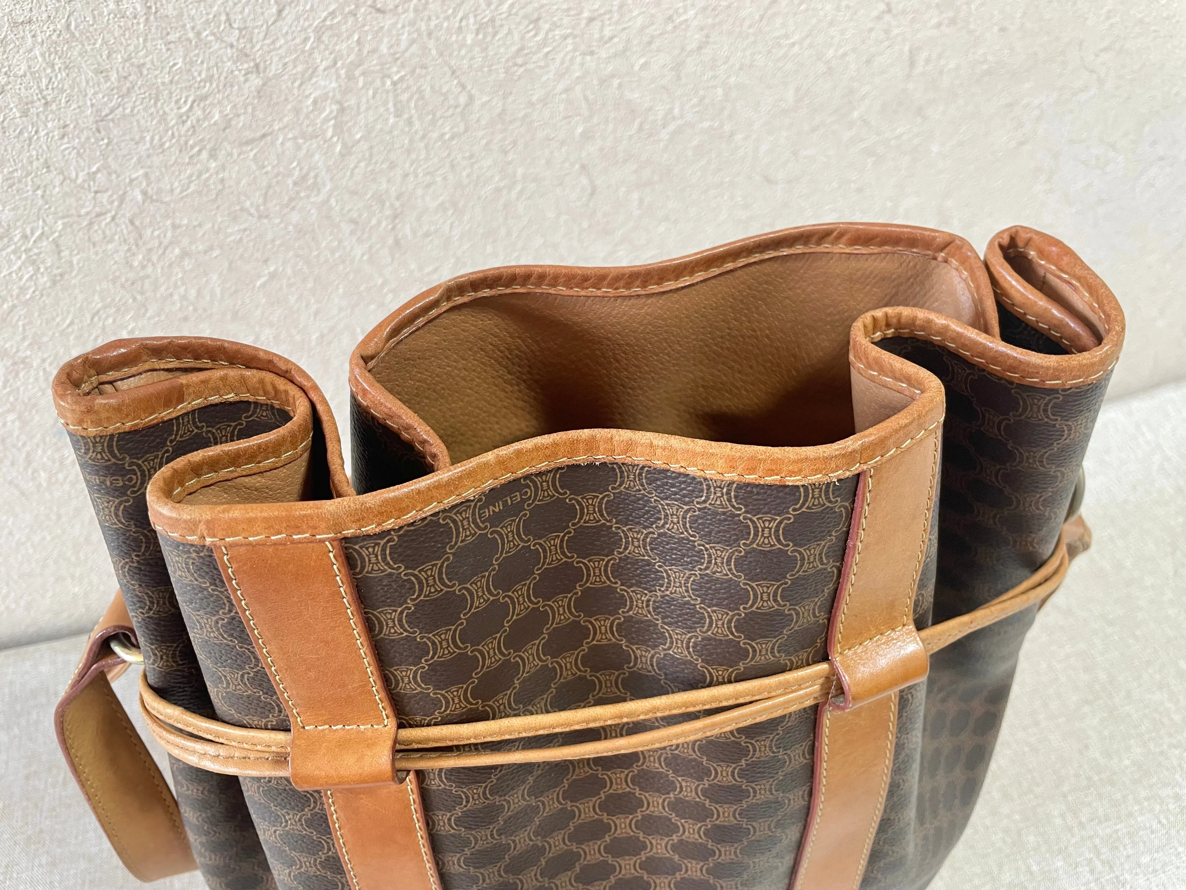 Vintage Celine hobo bucket shoulder bag in classic brown triomphe pattern with leather straps. 070218ys8