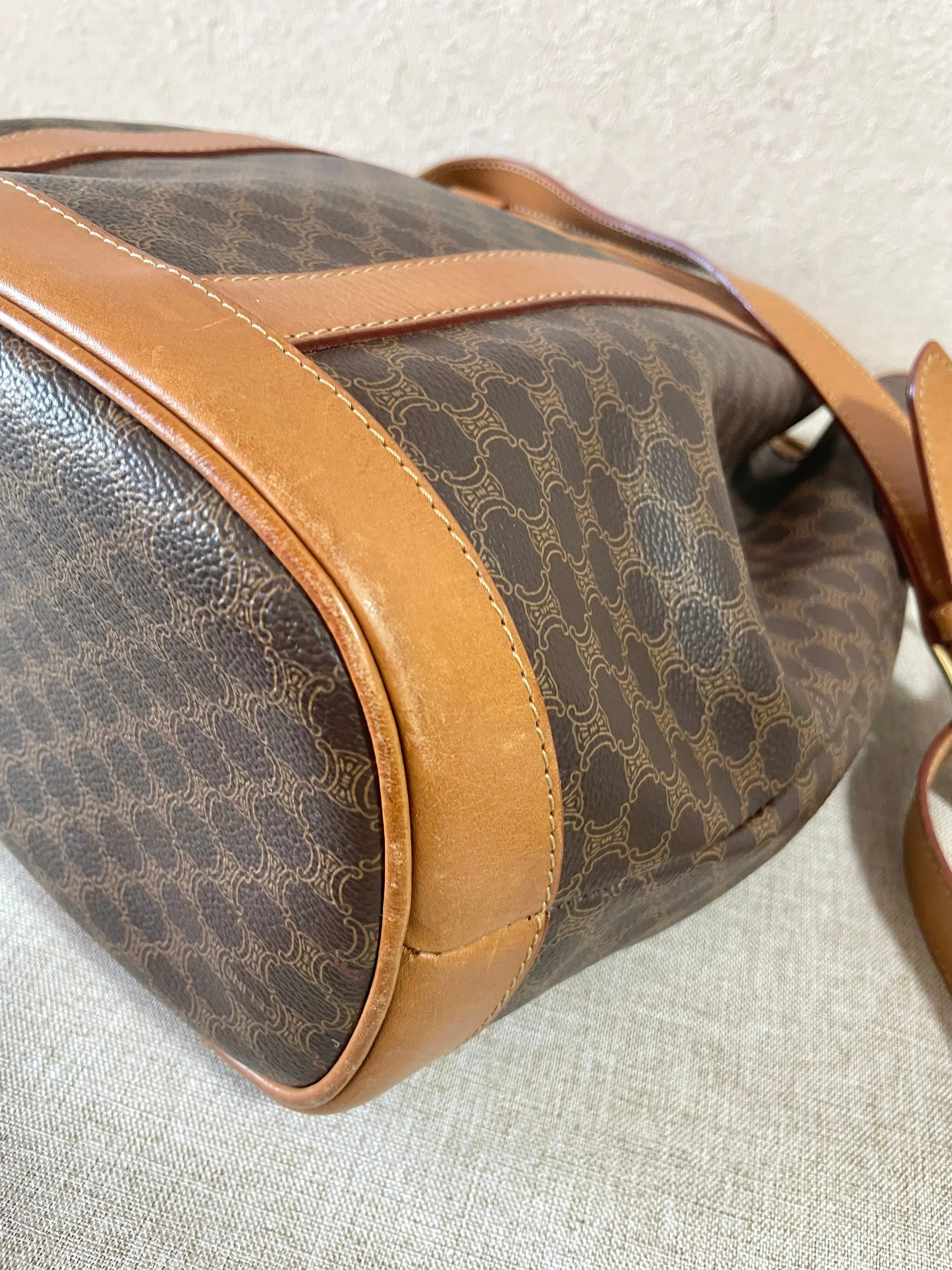 Vintage Celine hobo bucket shoulder bag in classic brown triomphe pattern with leather straps. 070218ys8