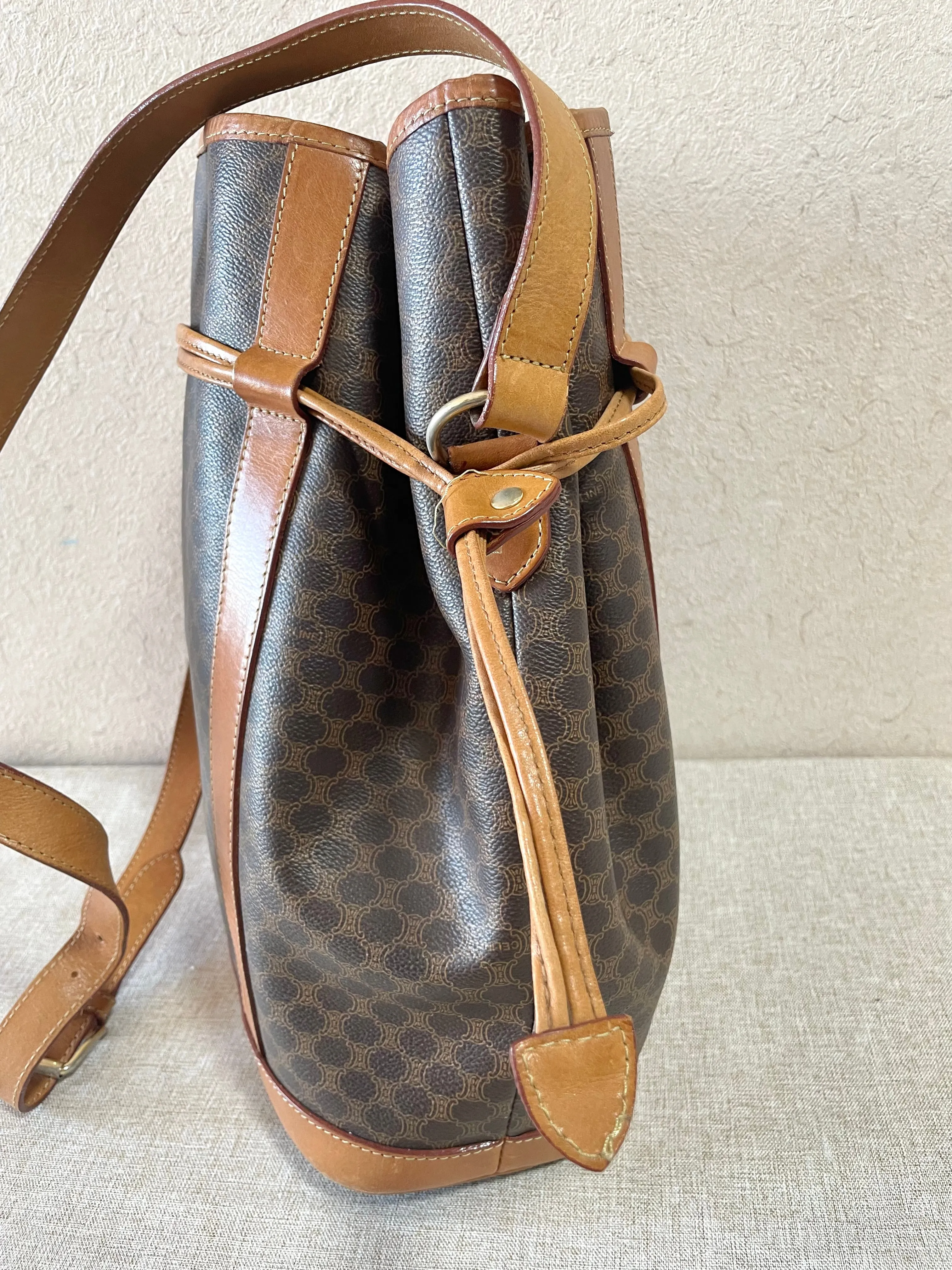 Vintage Celine hobo bucket shoulder bag in classic brown triomphe pattern with leather straps. 070218ys8