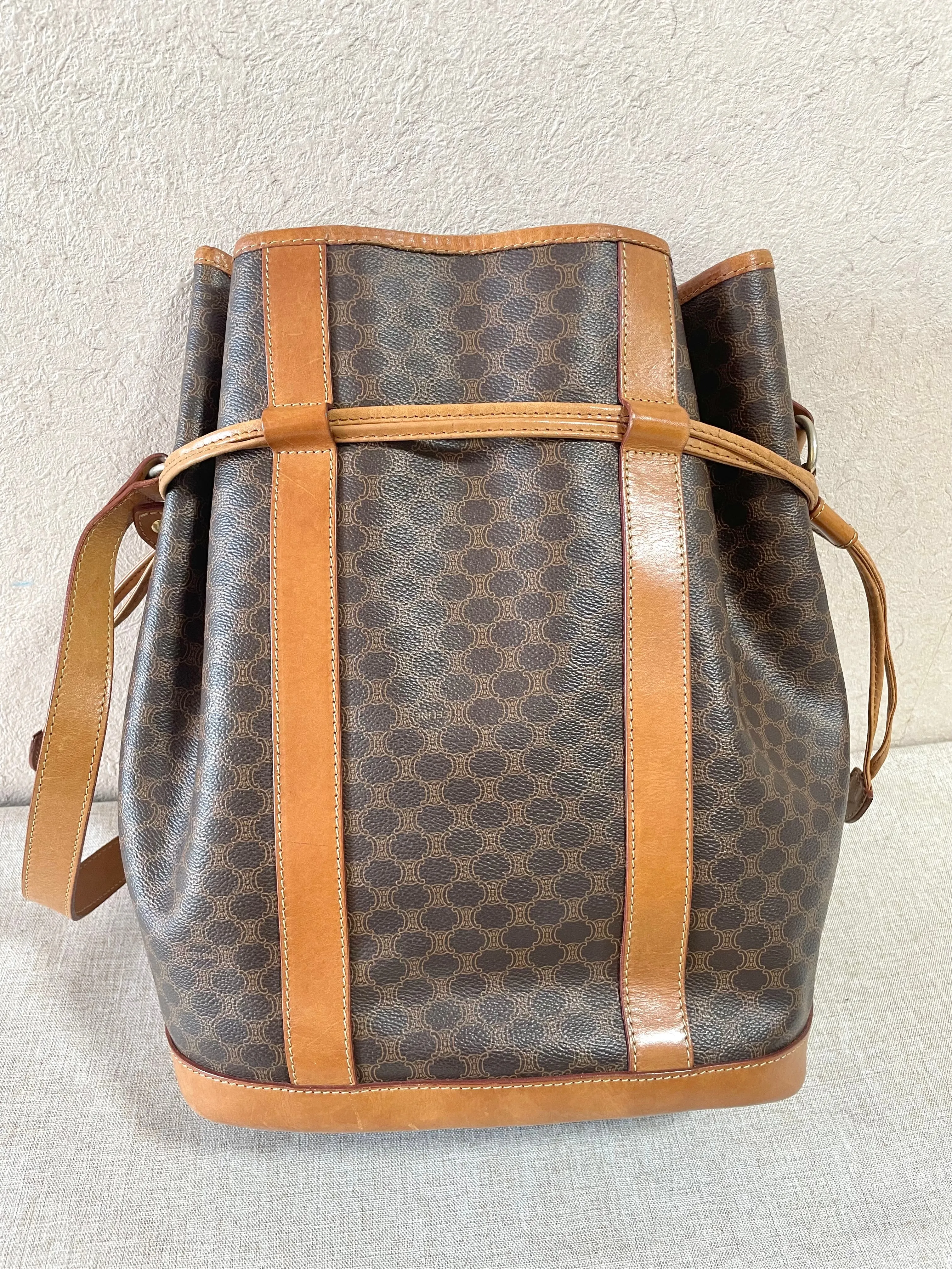 Vintage Celine hobo bucket shoulder bag in classic brown triomphe pattern with leather straps. 070218ys8