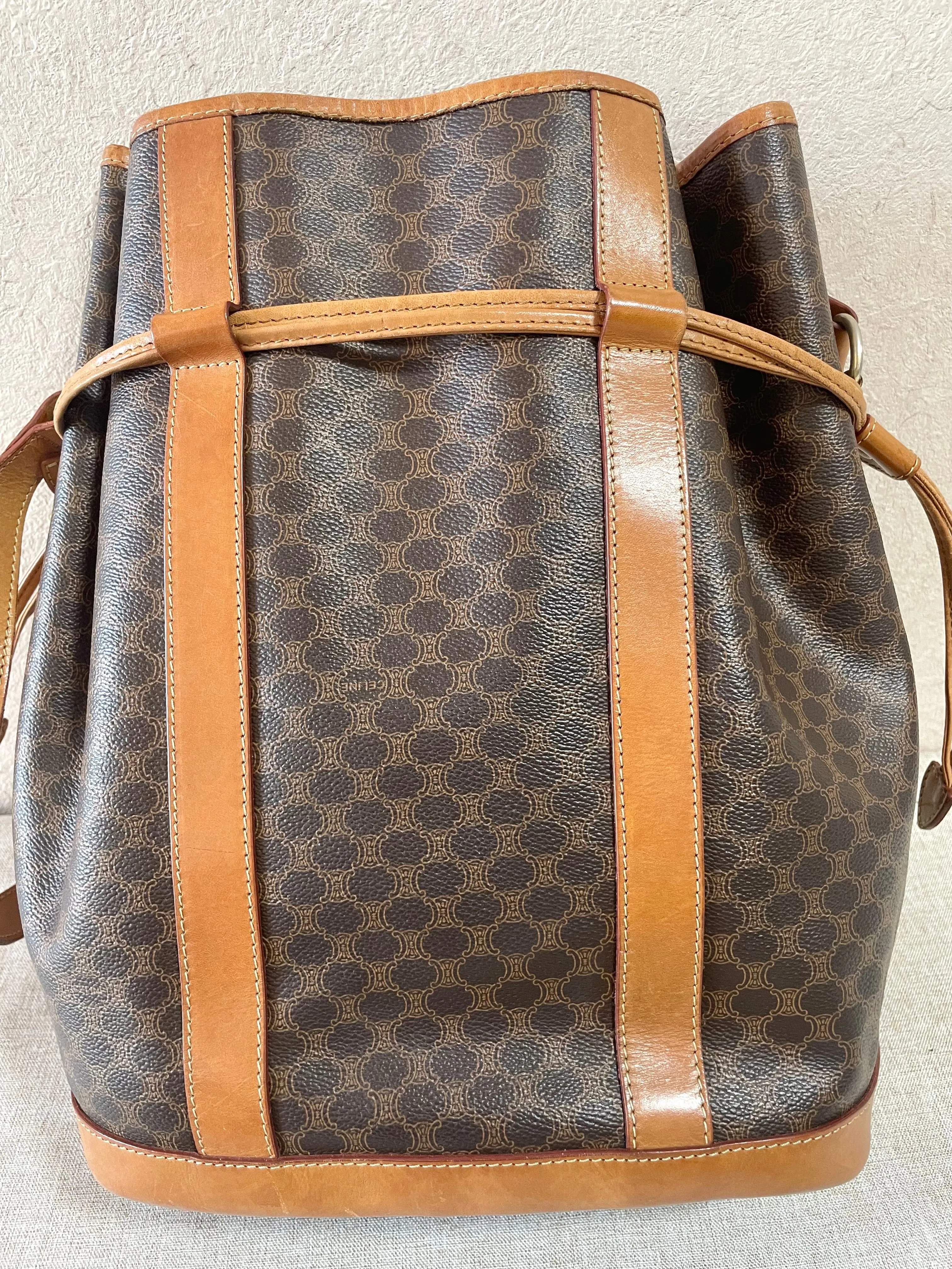 Vintage Celine hobo bucket shoulder bag in classic brown triomphe pattern with leather straps. 070218ys8