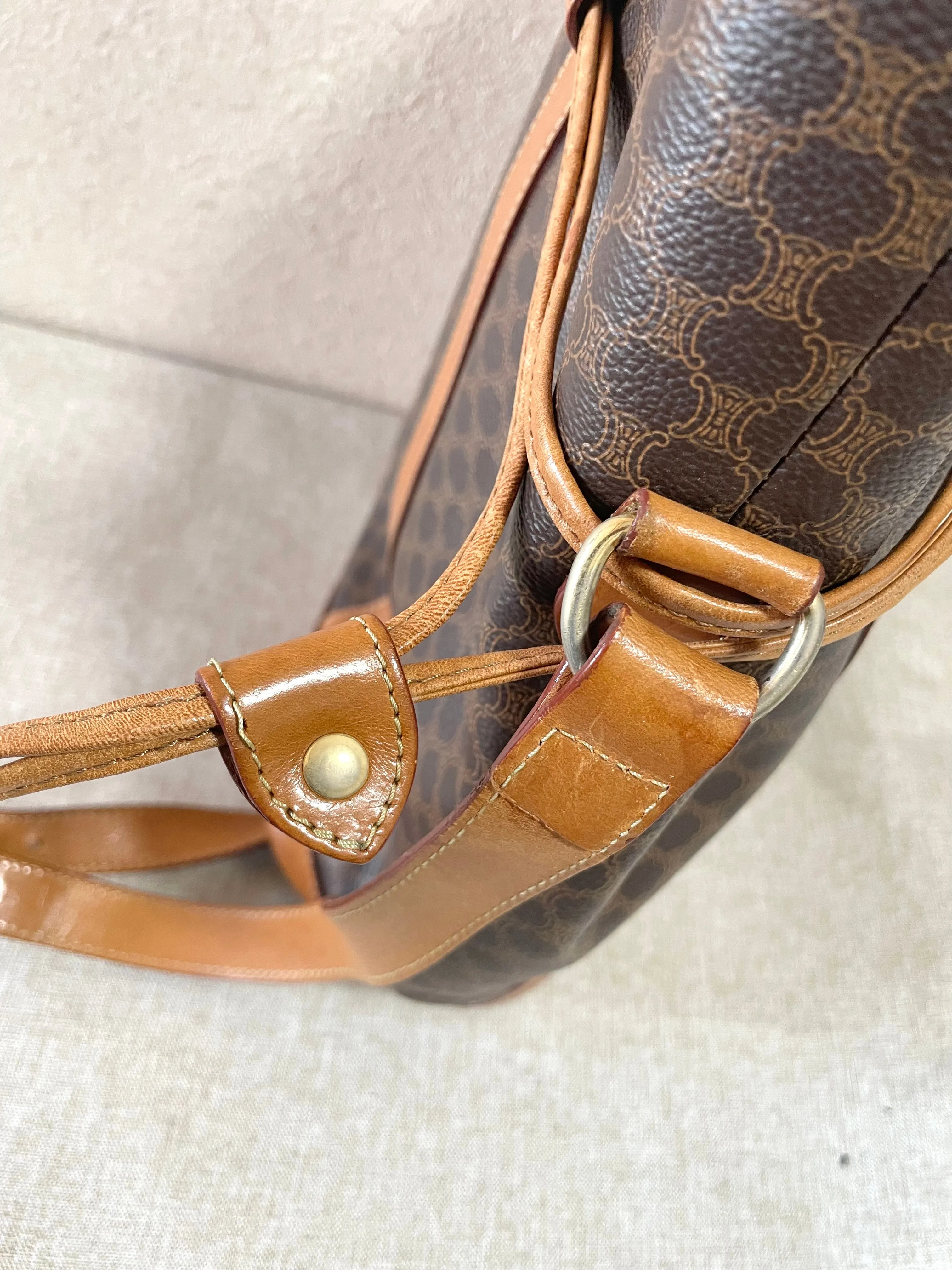 Vintage Celine hobo bucket shoulder bag in classic brown triomphe pattern with leather straps. 070218ys8