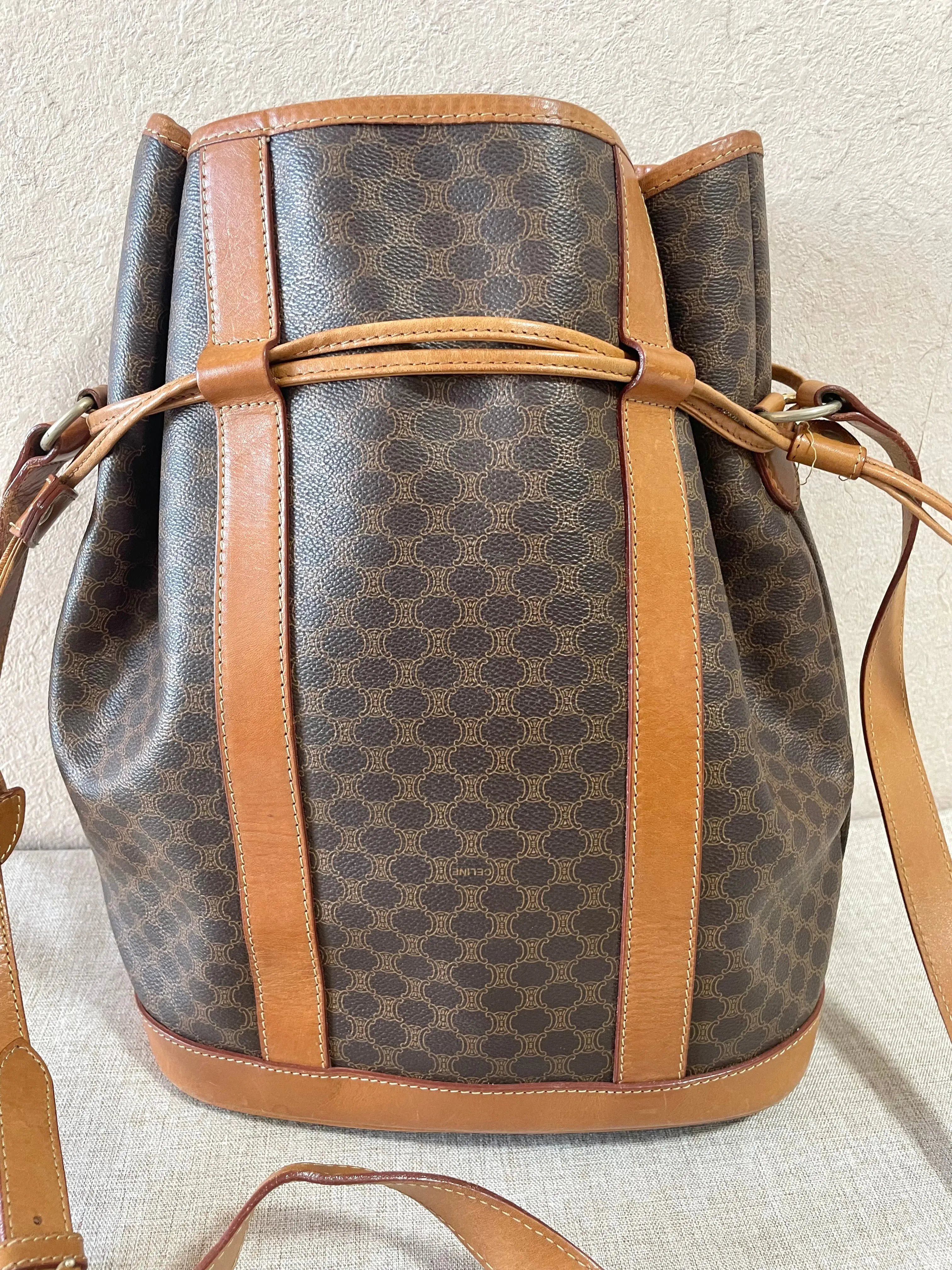 Vintage Celine hobo bucket shoulder bag in classic brown triomphe pattern with leather straps. 070218ys8