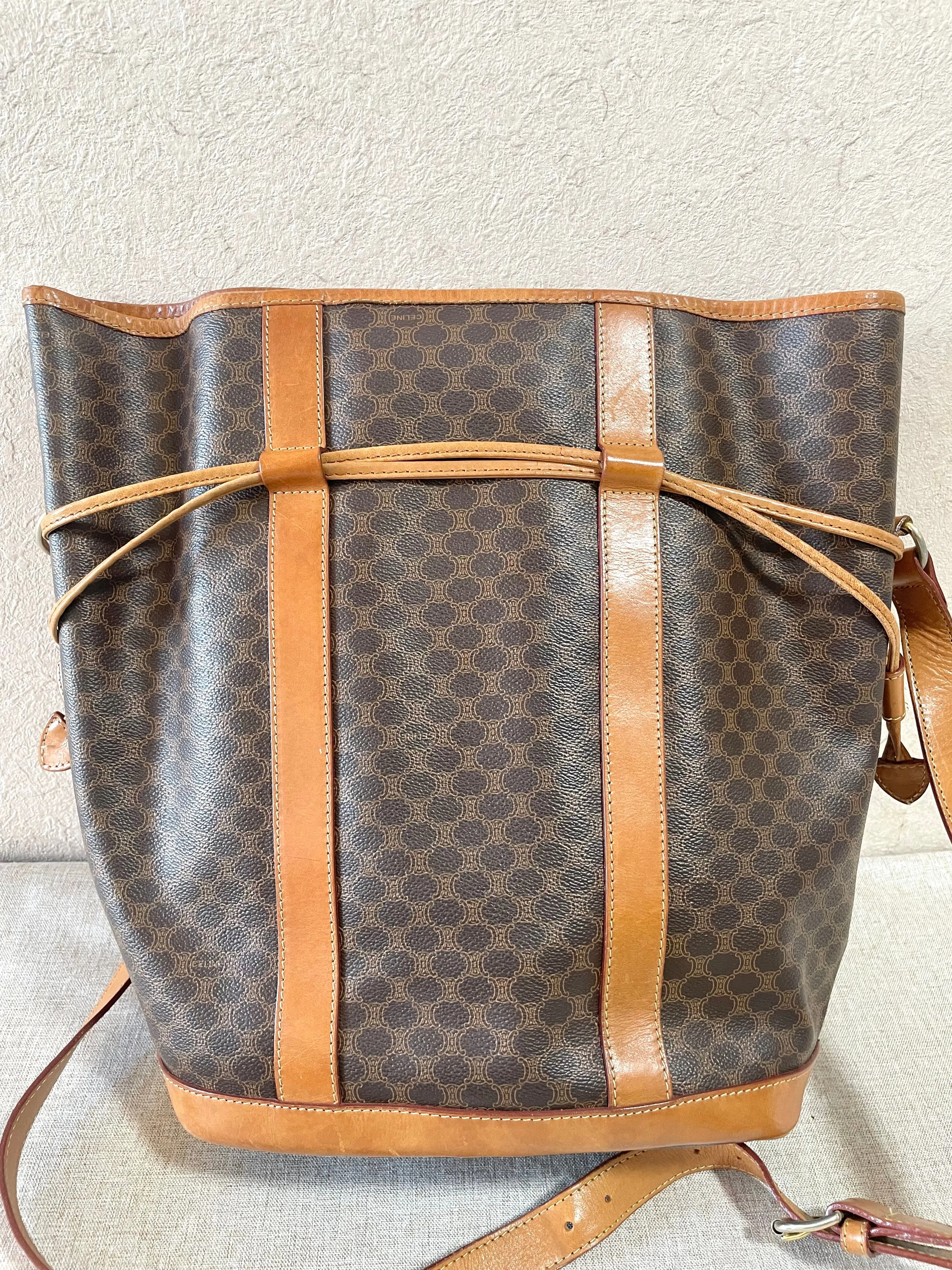 Vintage Celine hobo bucket shoulder bag in classic brown triomphe pattern with leather straps. 070218ys8