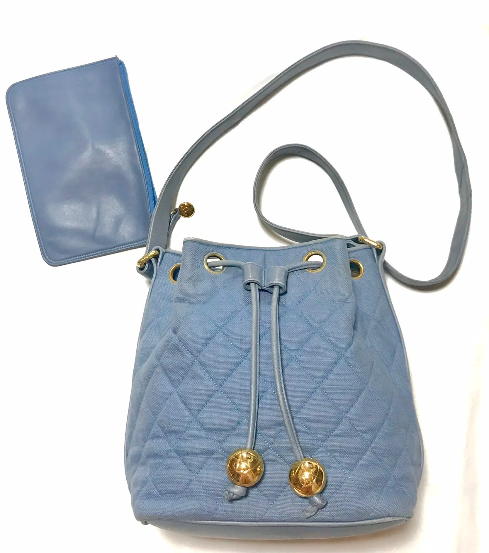 Vintage CHANEL blue quilted canvas and leather combo hobo bucket shoulder bag with drawstrings and golden CC mark balls. 060905r3