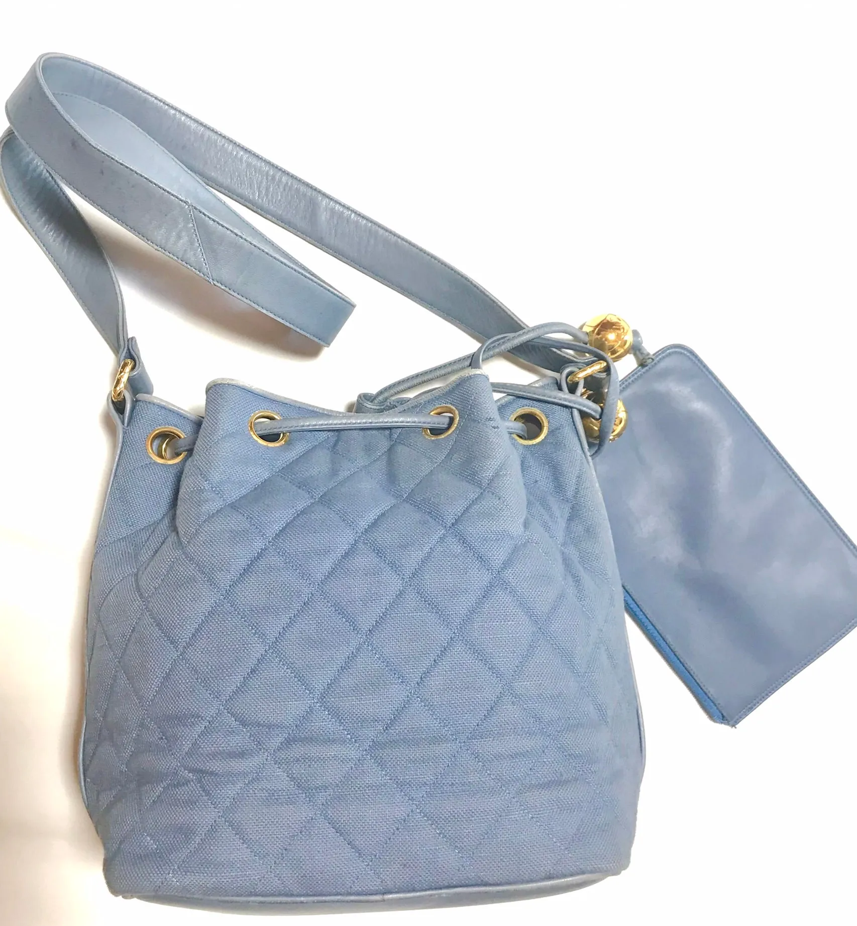Vintage CHANEL blue quilted canvas and leather combo hobo bucket shoulder bag with drawstrings and golden CC mark balls. 060905r3