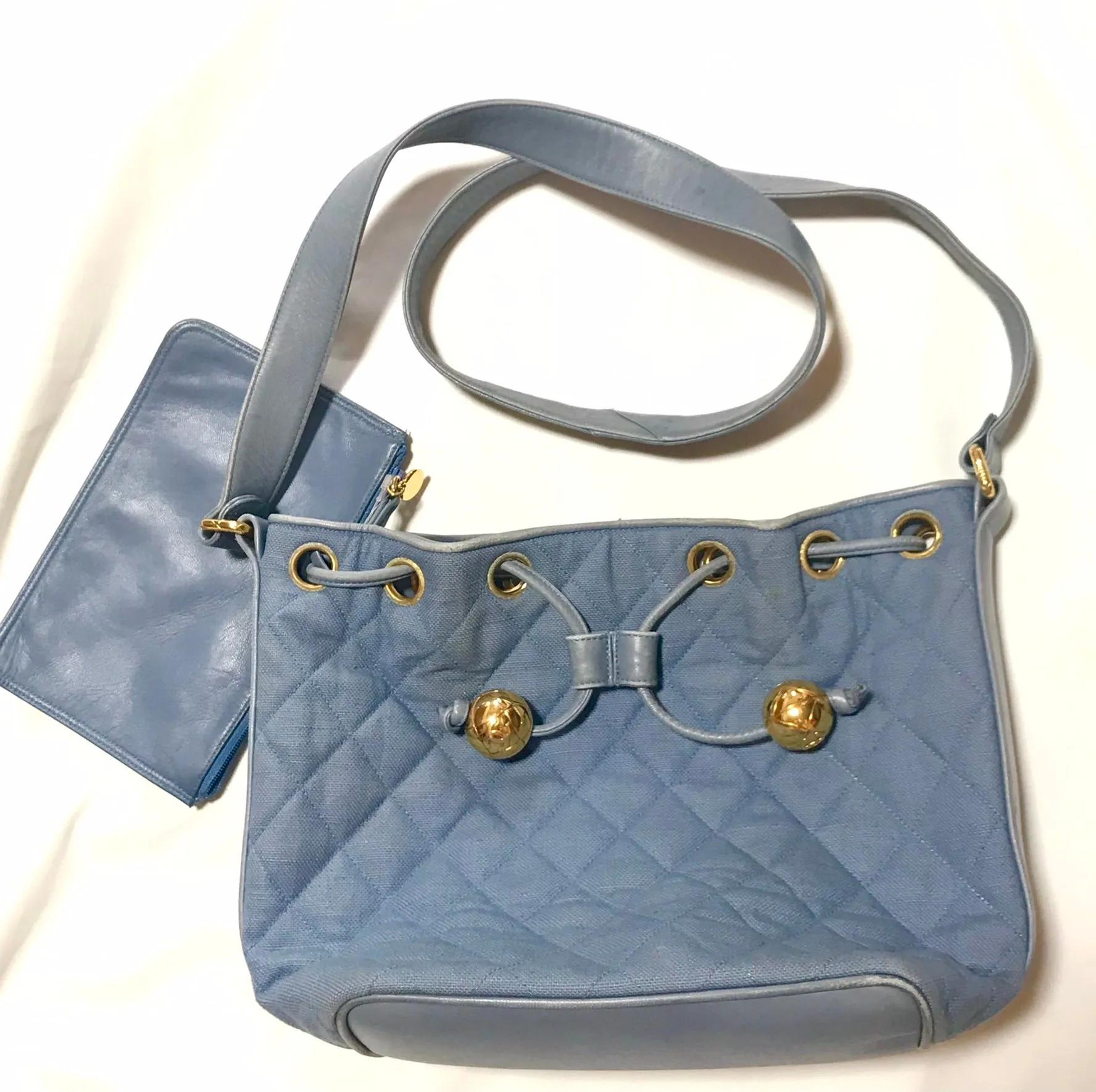 Vintage CHANEL blue quilted canvas and leather combo hobo bucket shoulder bag with drawstrings and golden CC mark balls. 060905r3