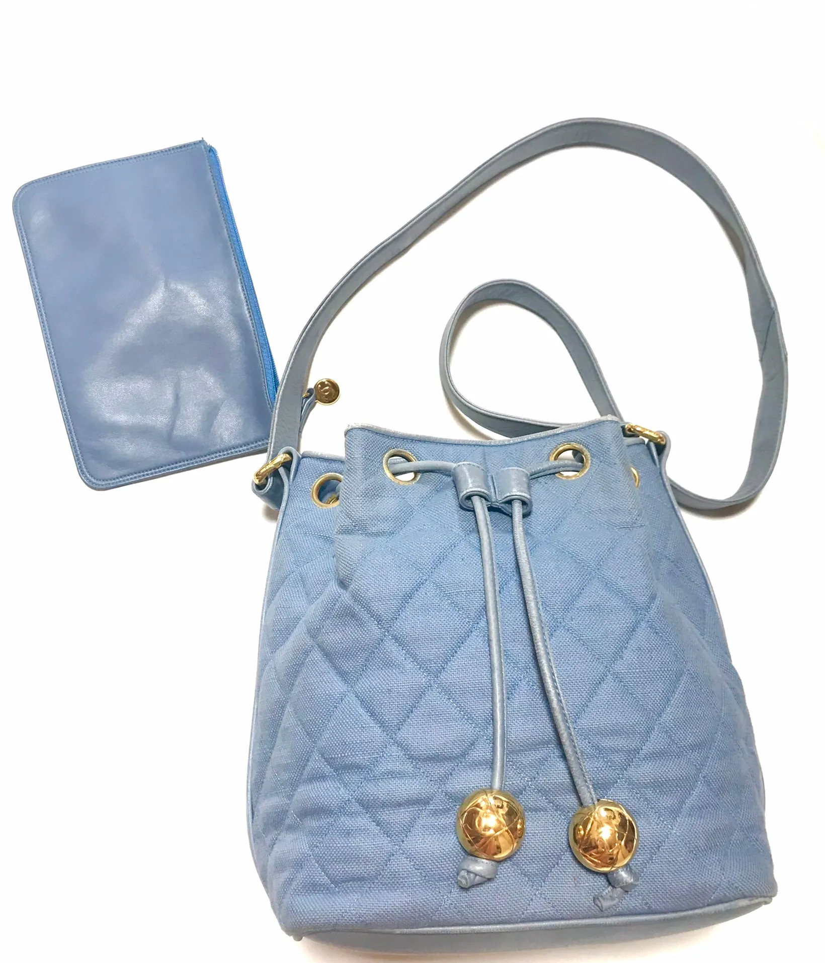 Vintage CHANEL blue quilted canvas and leather combo hobo bucket shoulder bag with drawstrings and golden CC mark balls. 060905r3