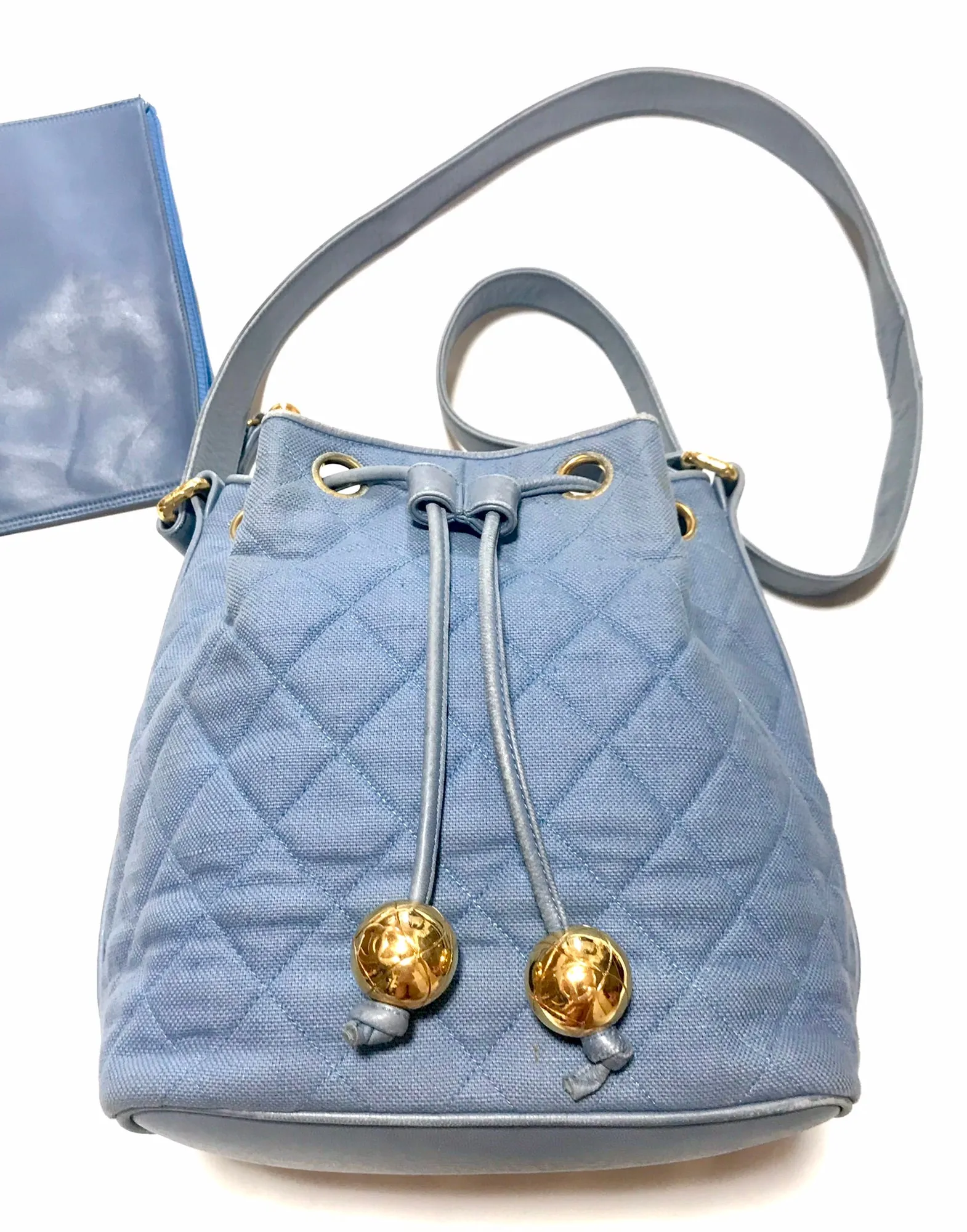 Vintage CHANEL blue quilted canvas and leather combo hobo bucket shoulder bag with drawstrings and golden CC mark balls. 060905r3