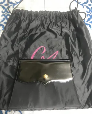 Vintage Christian Lacroix black patent enamel and nylon combo clutch bag with a sun flower shape logo motif.