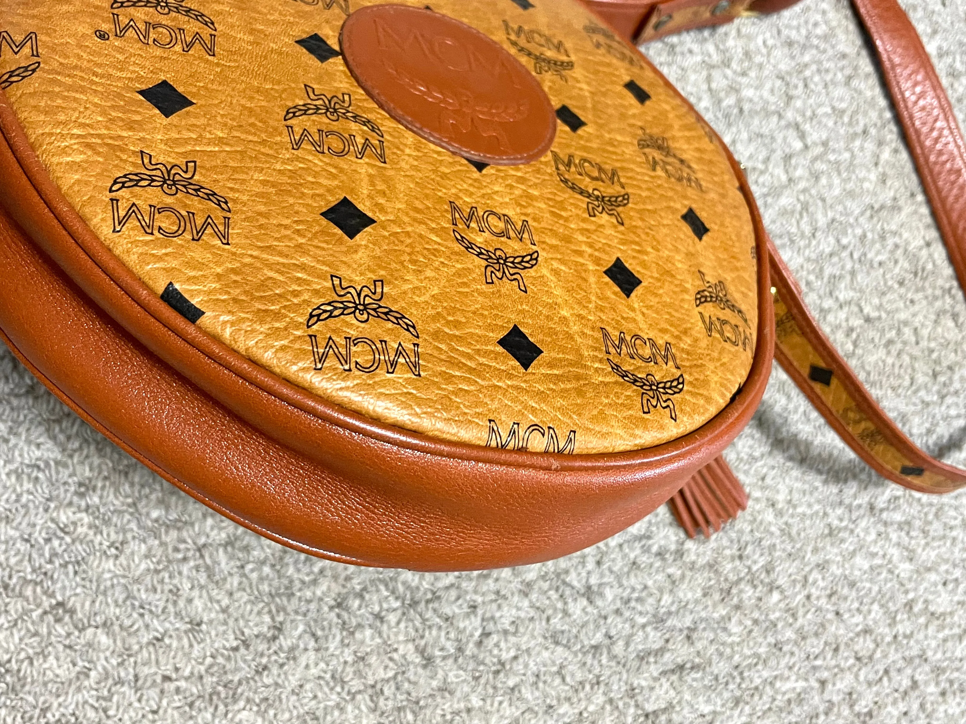 Vintage MCM brown monogram round Suzy Wong shoulder bag with brown leather trimmings. Designed by Michael Cromer. Unisex. 050715ya1